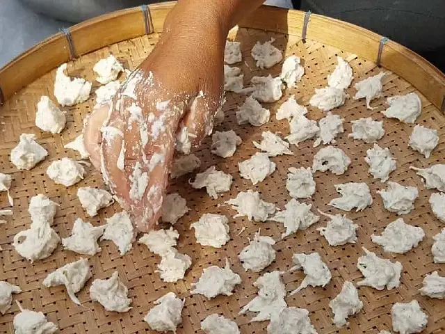 Yam nugget making and drying Image